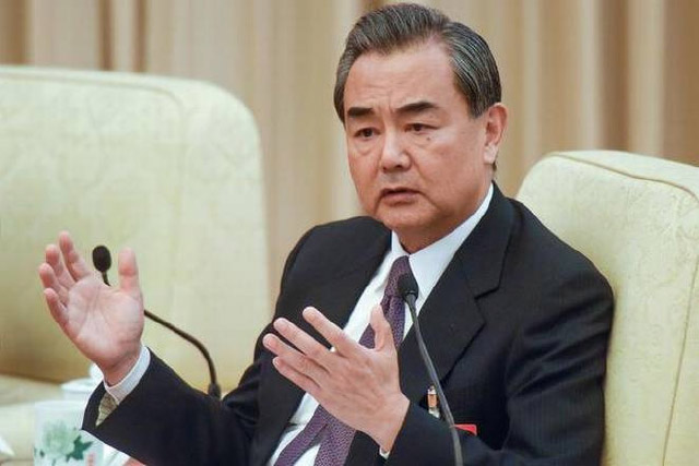 China Contributes To the Global  Economy and Peace, Chinese FM Says 